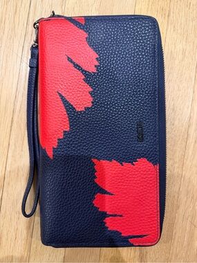 Tumi Navy Leather passport wallet wristlet with red flower print